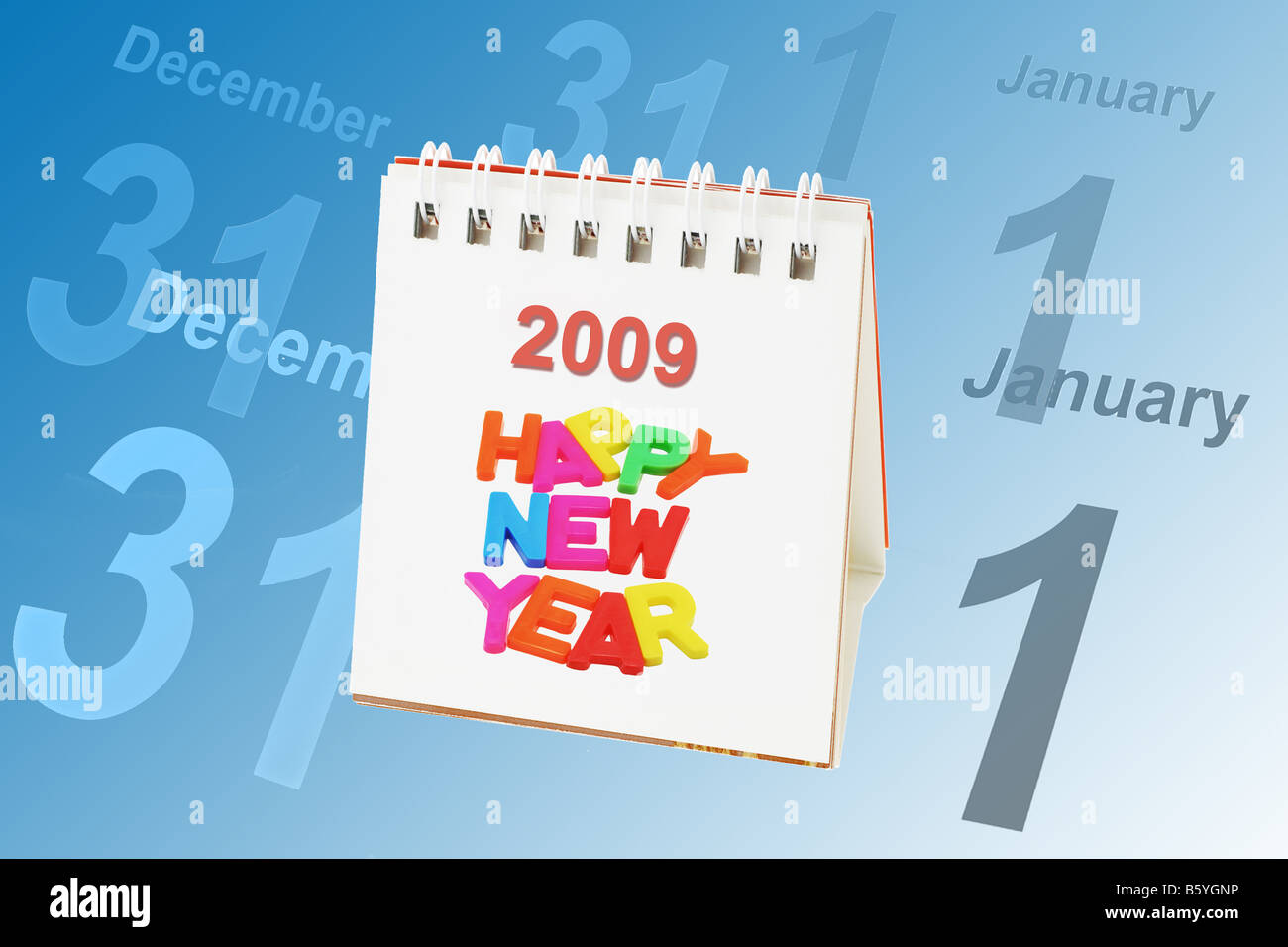 Desktop calendar showing 2009 with dates of Dec 31 and Jan 1 in the background Stock Photo