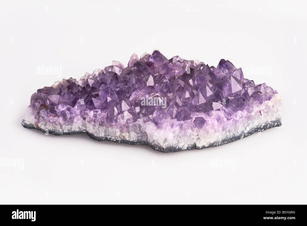 Amethyst crystal cluster on white background Stock Photo