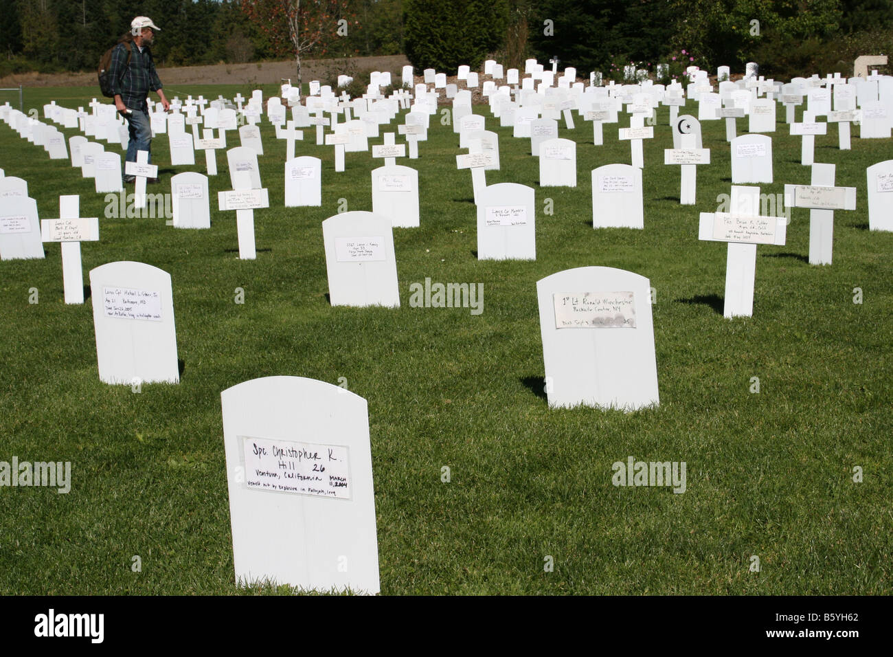A man walks through a display representing dead USA solders due to the Iraq war. Washington, USA Stock Photo