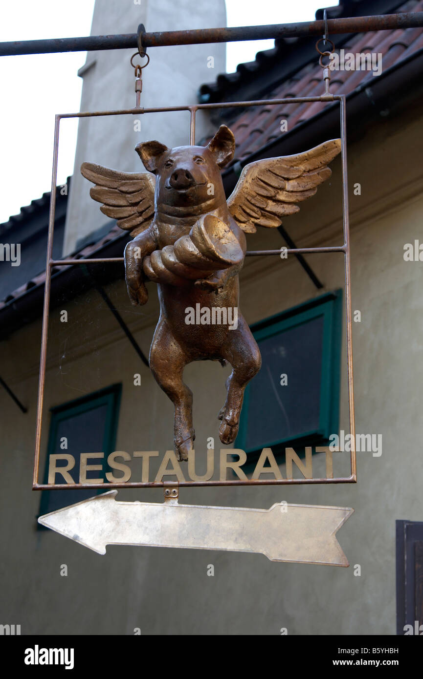 Flying pig restaurant sign in the Golden Lane, Prague Castle Stock Photo -  Alamy