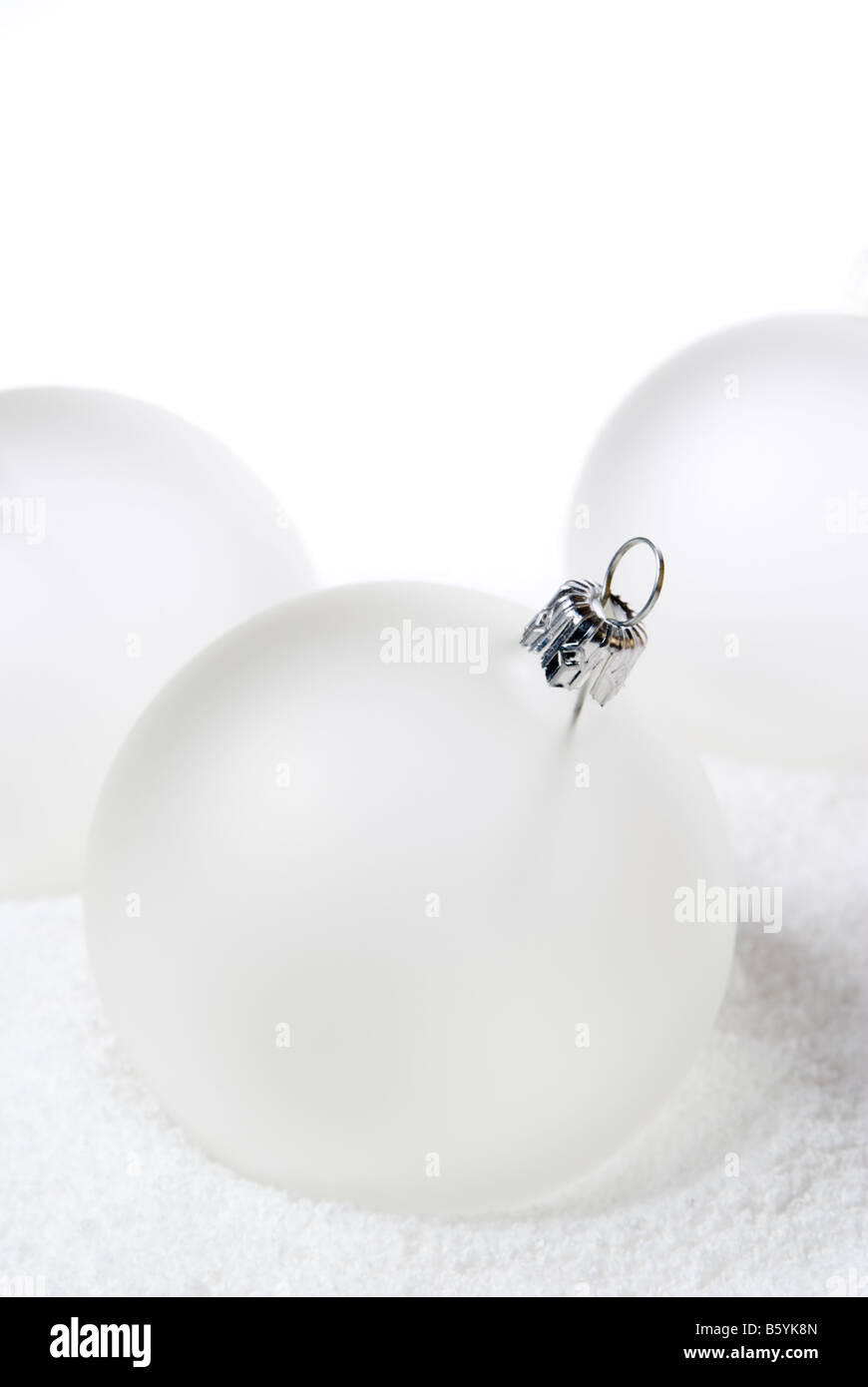 Christmas balls lying on the snow. aRGB. Stock Photo