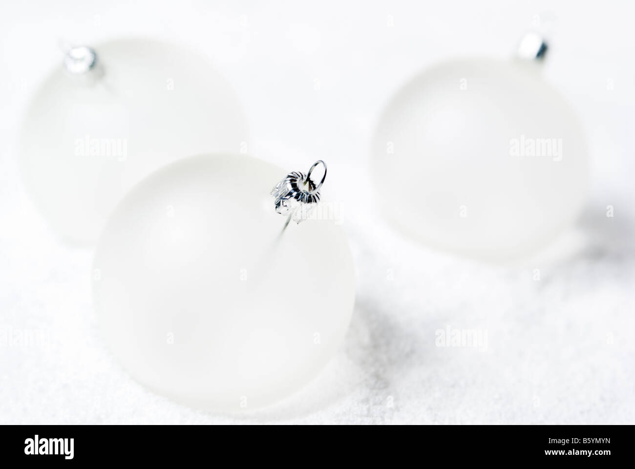 Christmas balls lying on the snow. aRGB. Stock Photo