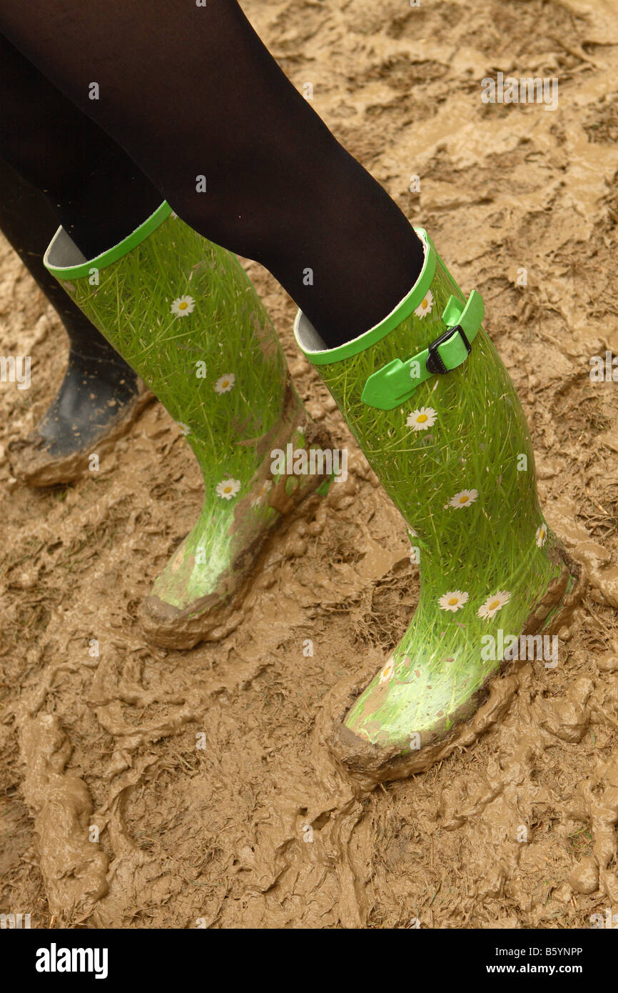 Pretty decorated wellington boots in the mud at Glastonbury Festival June 2008 Stock Photo