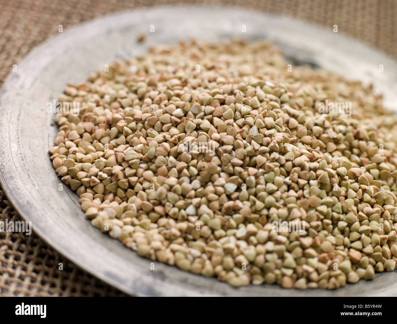 Grains of Quinoa on a Pewter Plate Stock Photo