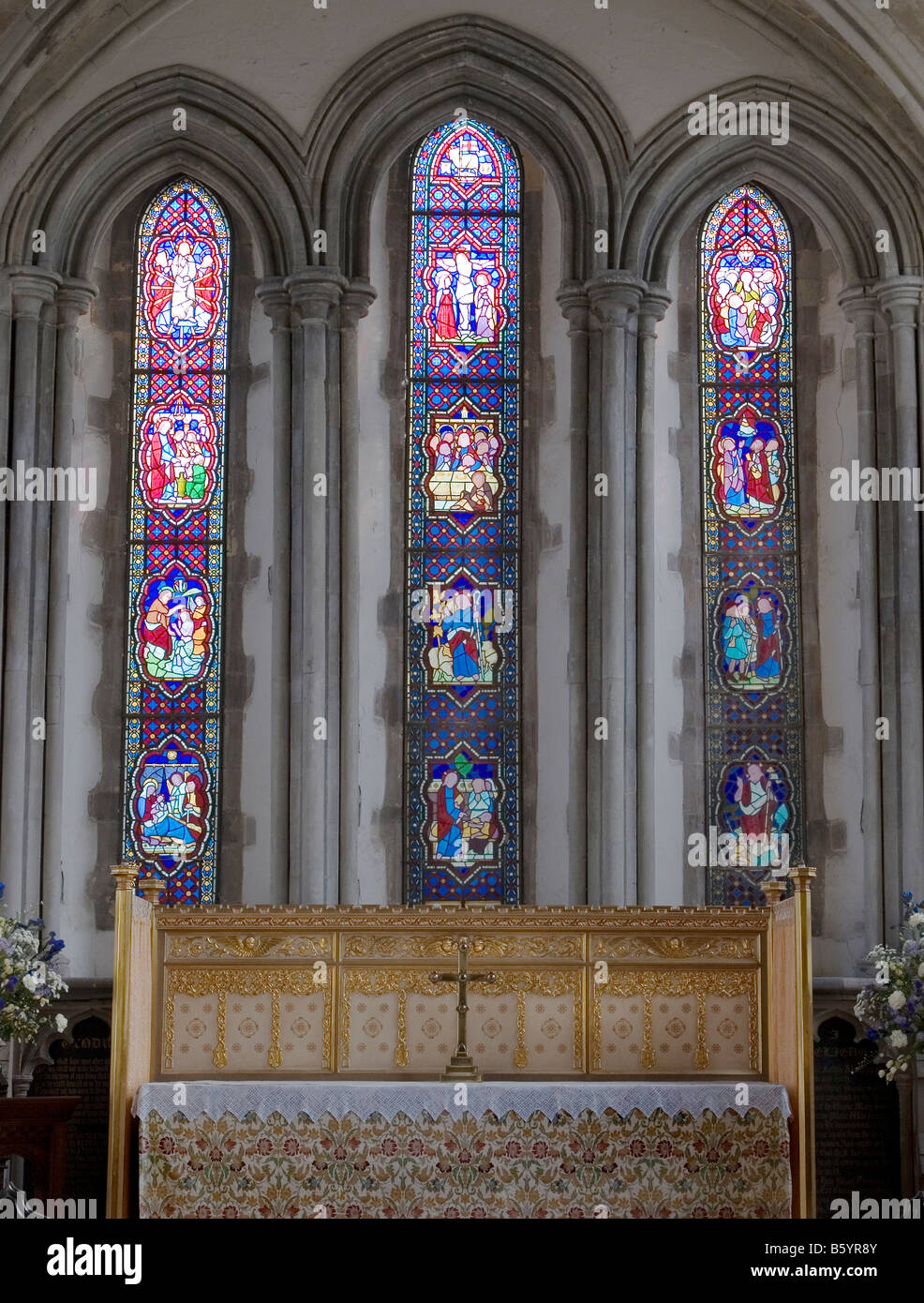 Stained Glass Window behind the alter at Minster,Kent,UK Stock Photo