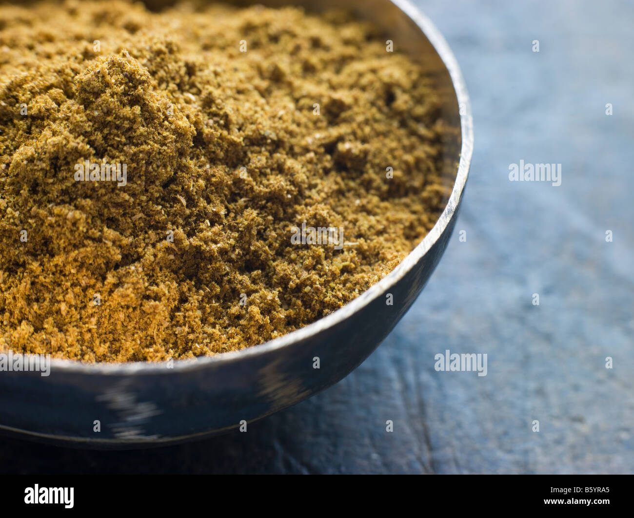 Dish of Madras Curry Powder Stock Photo