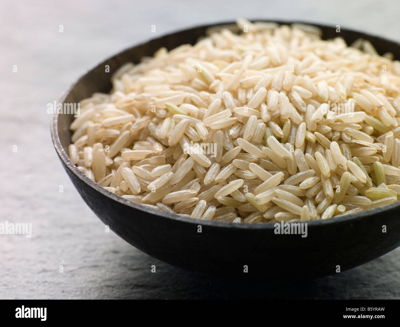 Bowl of Uncooked Basmati Rice Stock Photo