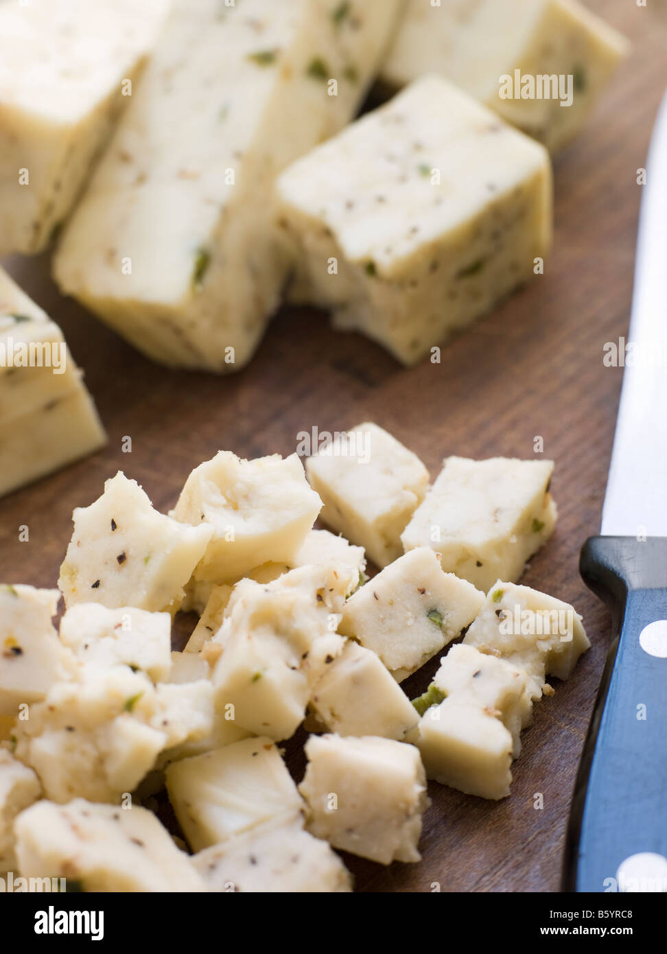 Pieces of Paneer Cheese with Spices Stock Photo