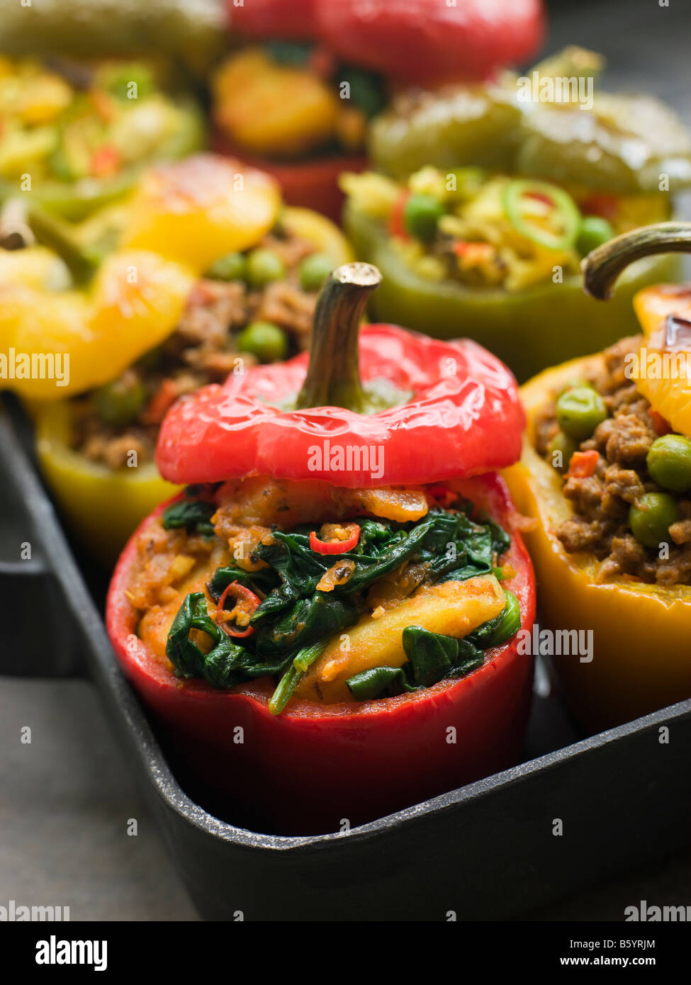 Bell Peppers stuffed with Keema Sag Aloo and Vegetable Pilau Stock Photo
