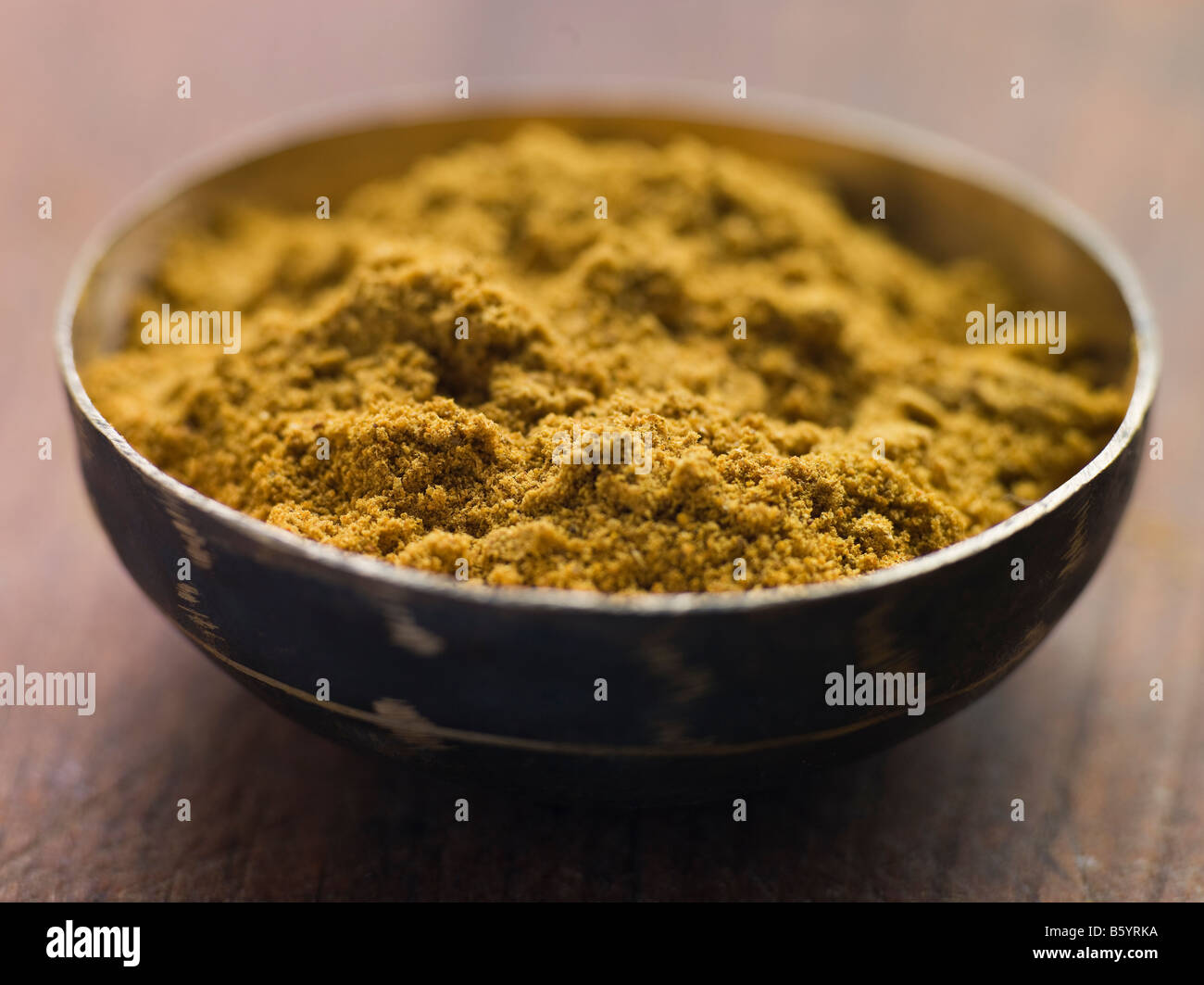 Dish of Ground Cumin Stock Photo
