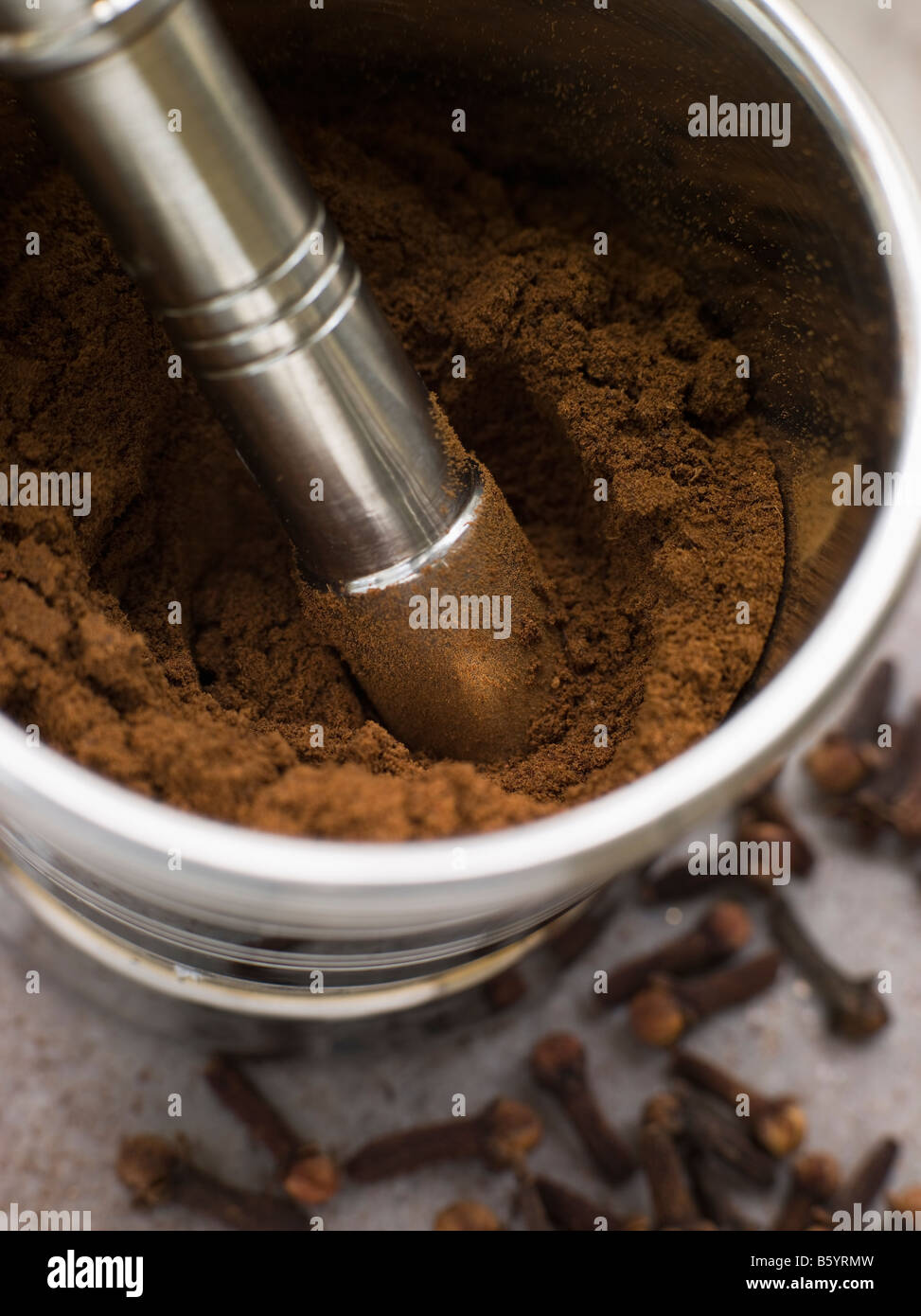 Ground Clove Powder in a Pestle and Mortar Stock Photo Alamy