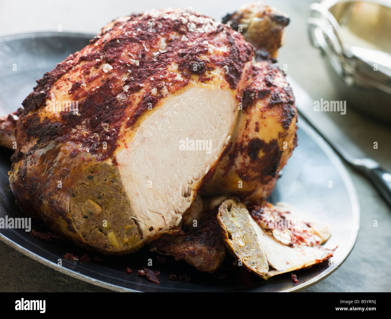 Roast Tandoori Chicken stuffed with Keema carved Stock Photo