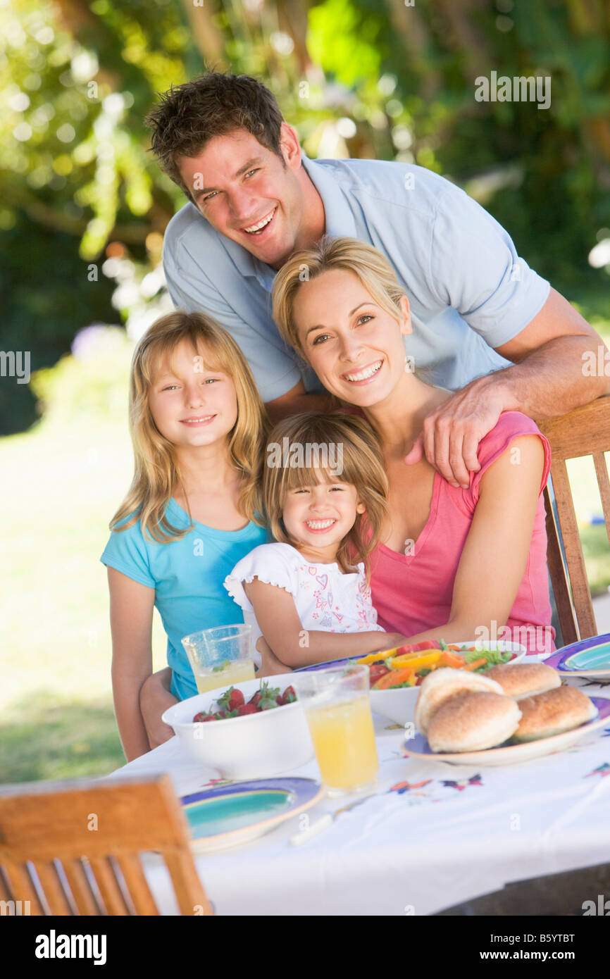 Family Enjoying A Barbeque Stock Photo