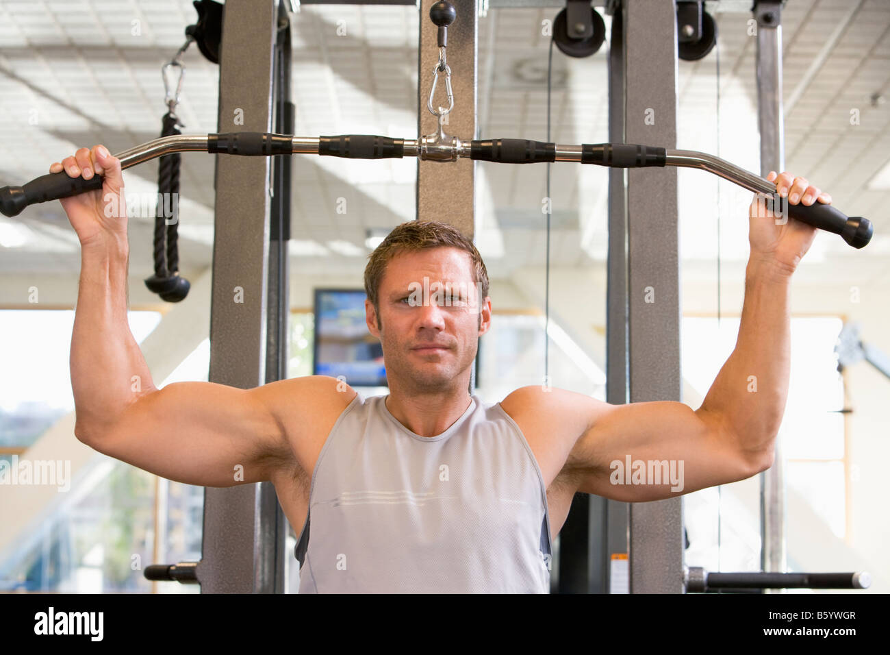 Man Weight Training At Gym Stock Photo - Alamy