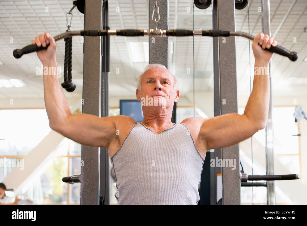 Man Weight Training At Gym Stock Photo - Alamy