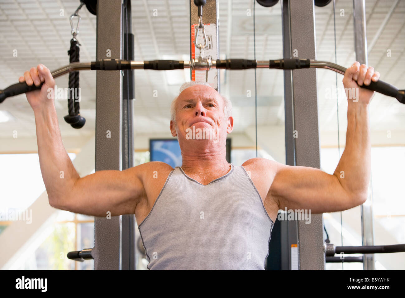 Man Weight Training At Gym Stock Photo - Alamy