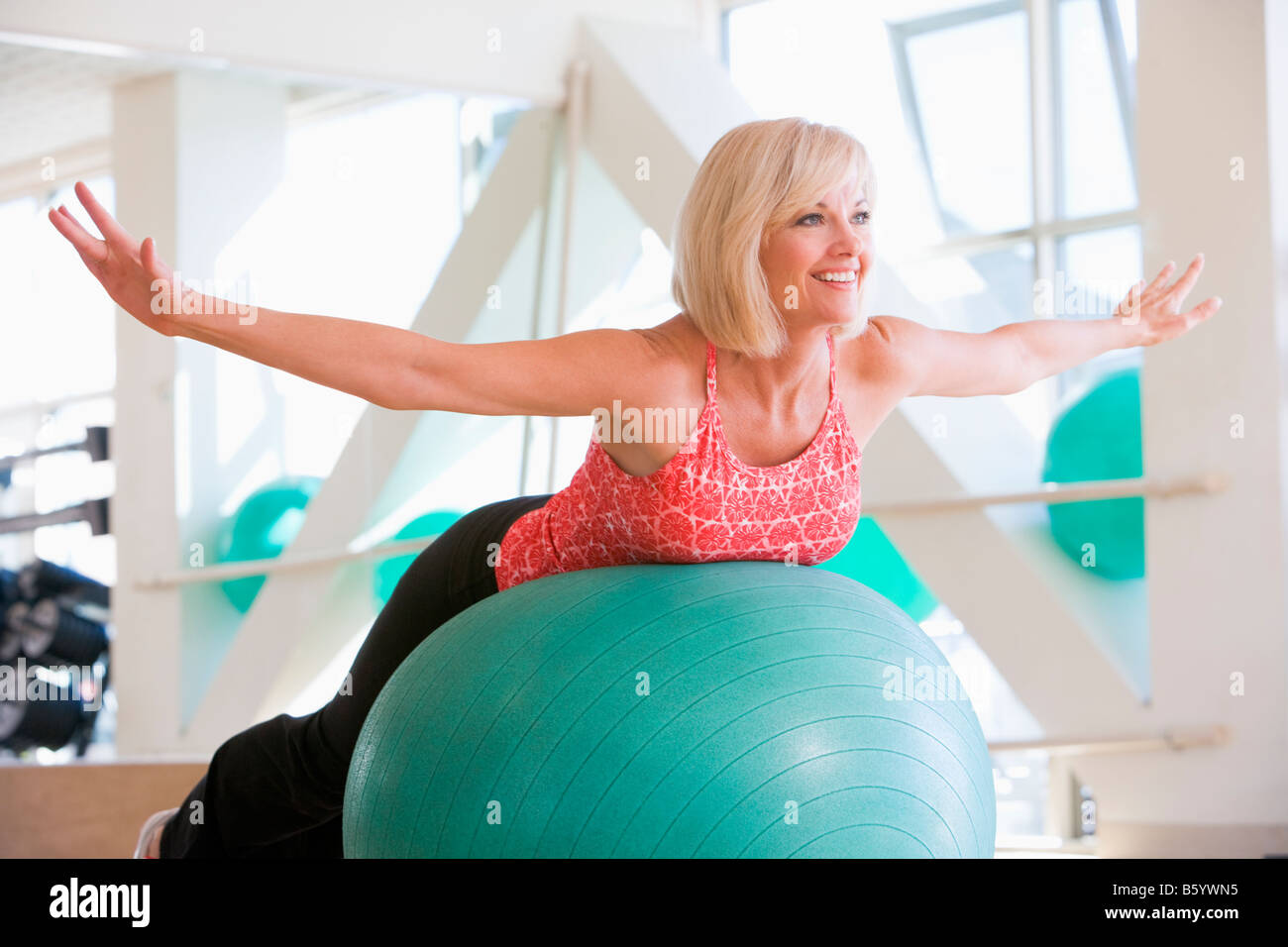 Woman Balancing On Swiss Ball Stock Photo