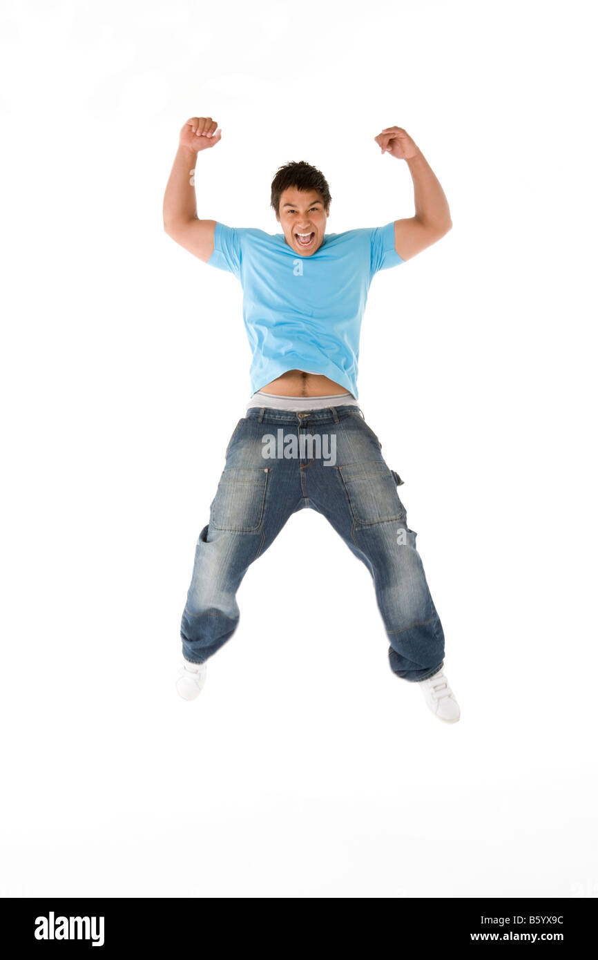 Teenage Boy Jumping In The Air Stock Photo