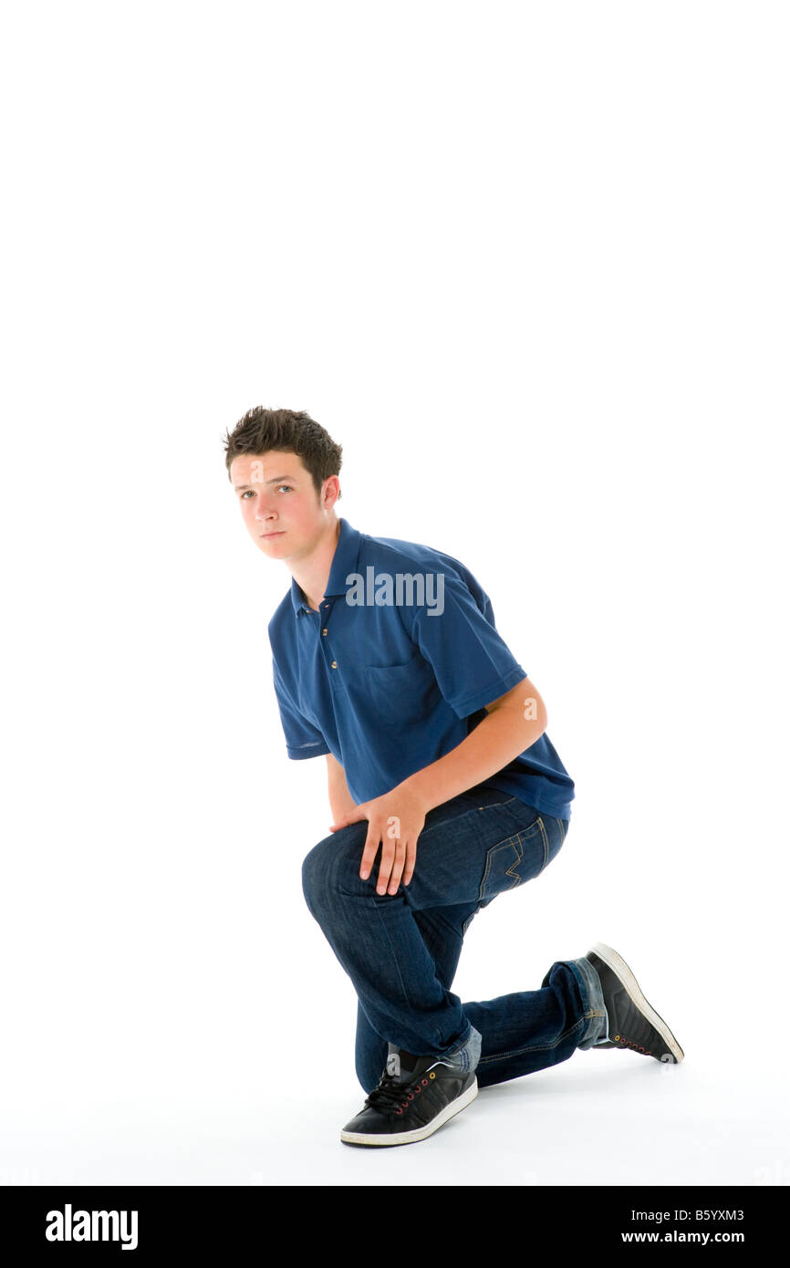 Boy kneeling hi-res stock photography and images - Alamy
