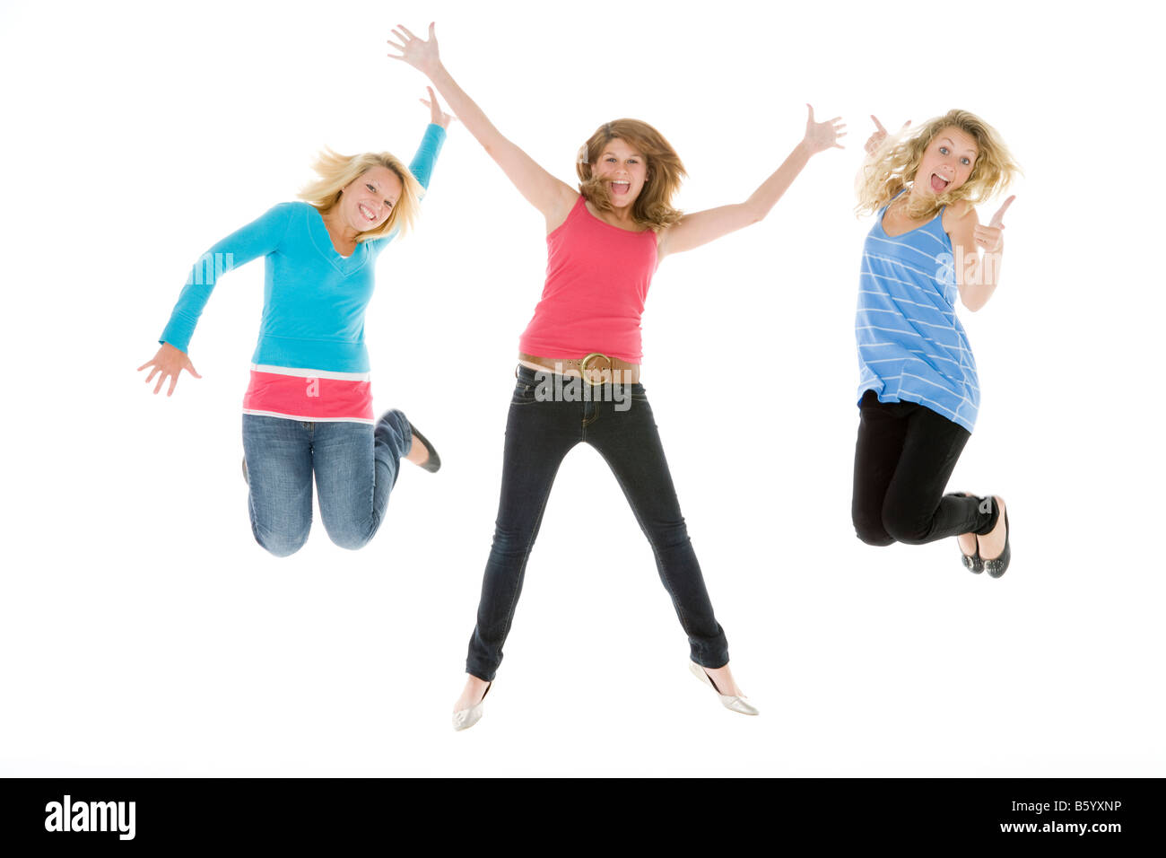 Teenage Girls Jumping In The Air Stock Photo