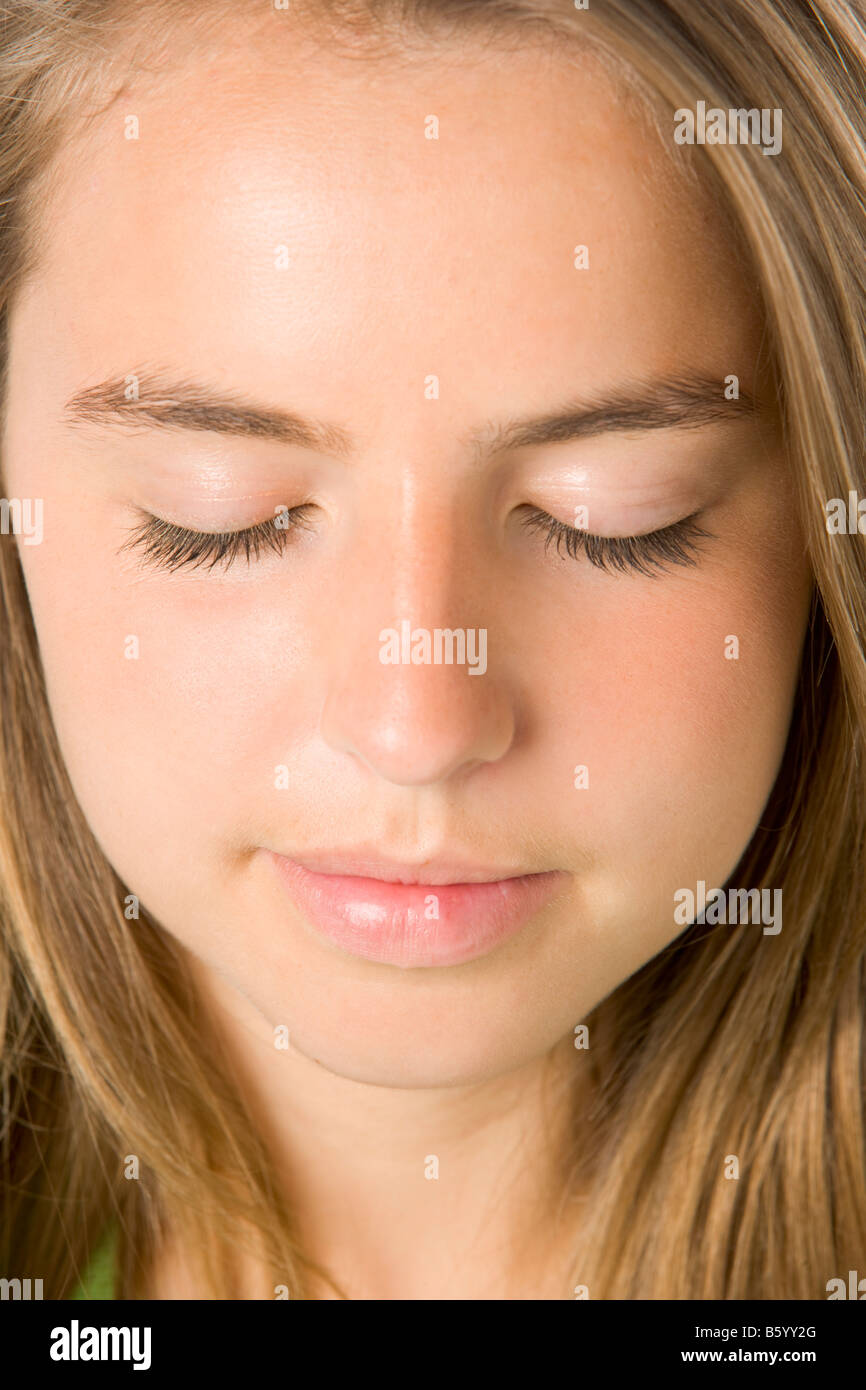Portrait Of Teenage Girl With Eyes Closed Stock Photo