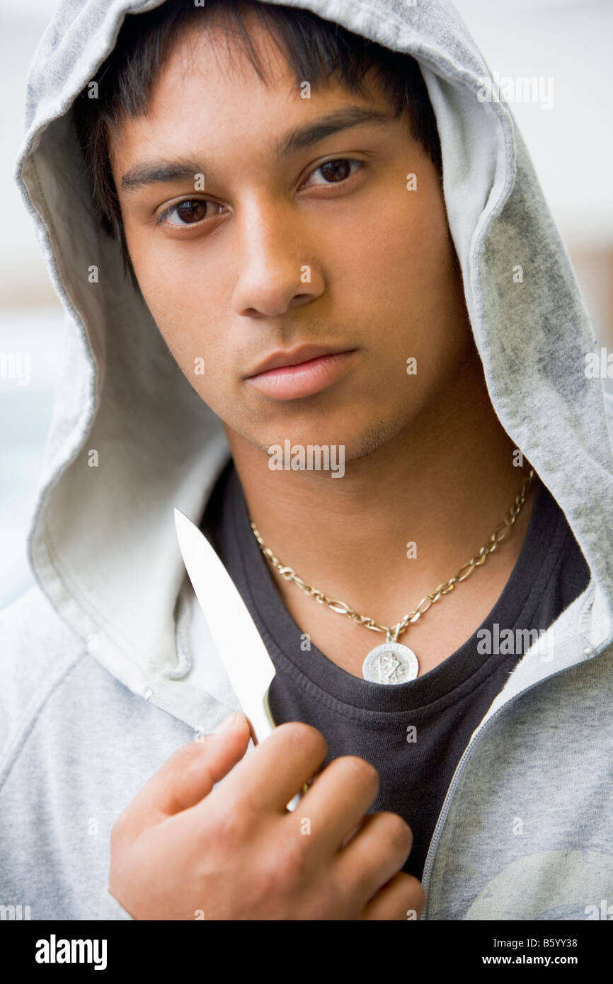 Teenage Boy Brandishing Knife Stock Photo Alamy