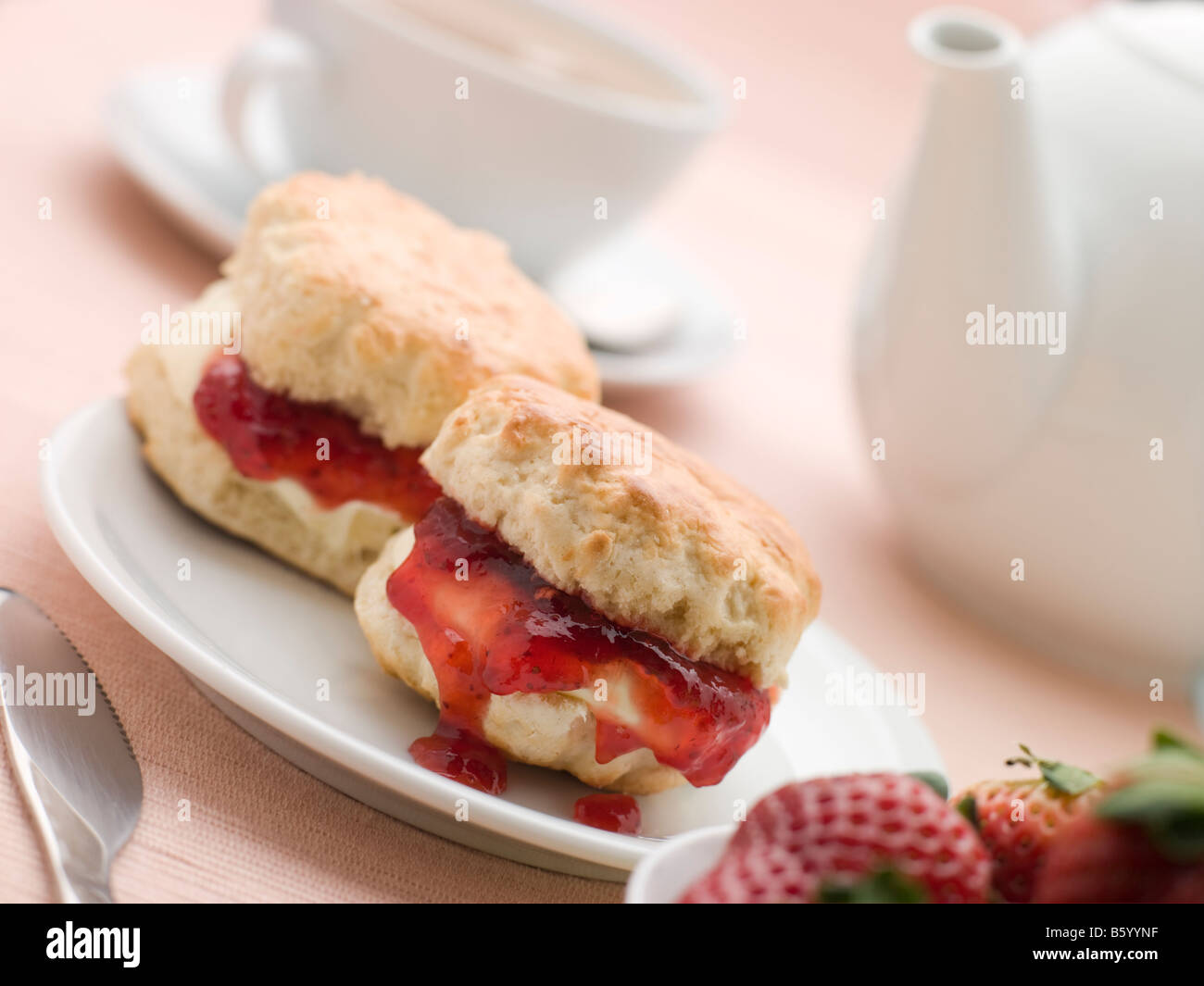 Scones Jam Clotted Cream and Strawberries with Afternoon Tea Stock Photo