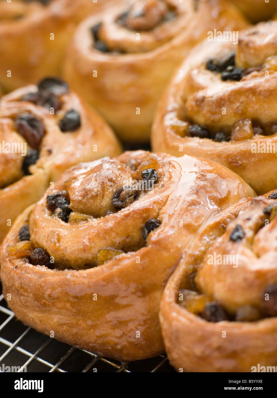 Chelsea Buns on a cooling rack Stock Photo