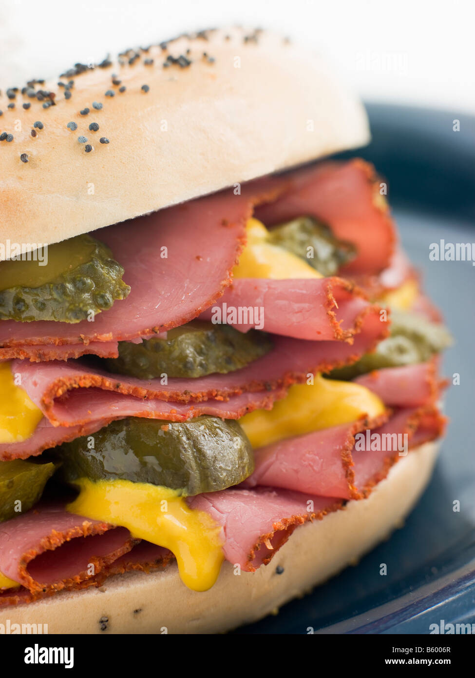 Pastrami mustard and pickle bagel sandwich hires stock photography and