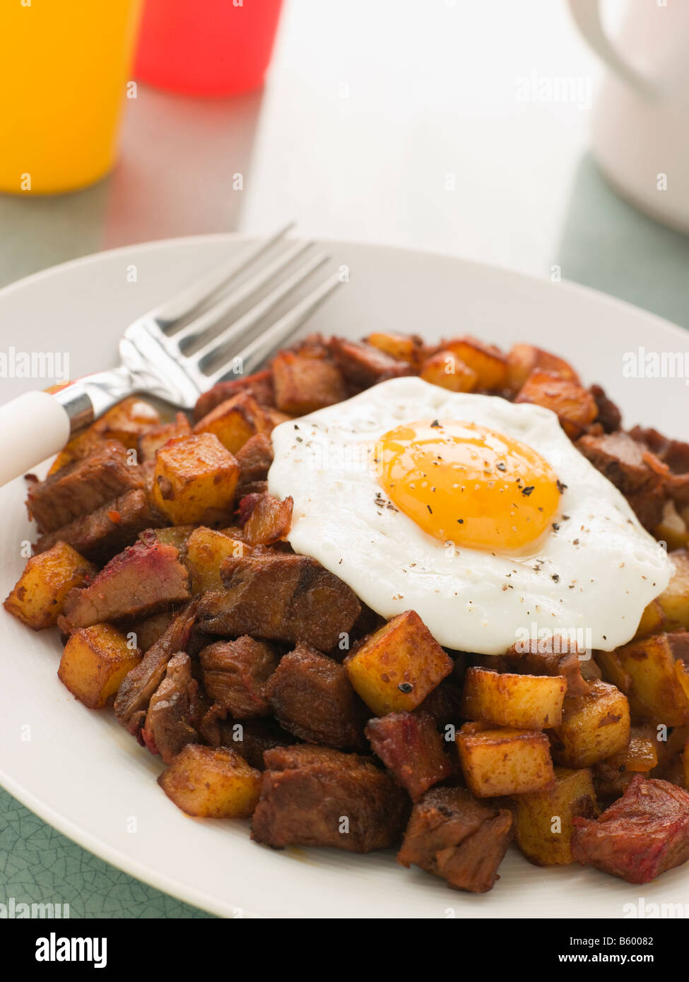 Corned Beef Hash With a Fried Egg and Black Pepper Stock Photo Alamy