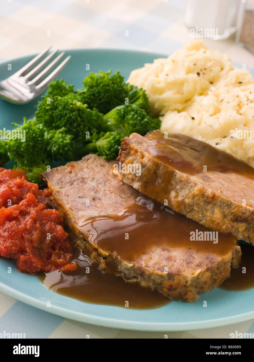 Mama S Meatloaf With Mashed Potato Broccoli Tomatoes And Gravy Stock Photo Alamy