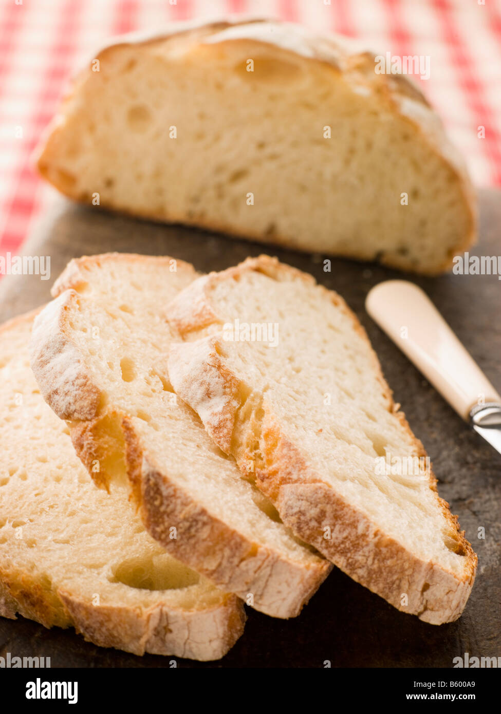 Loaf and Slices of American Sour Dough Bread Stock Photo