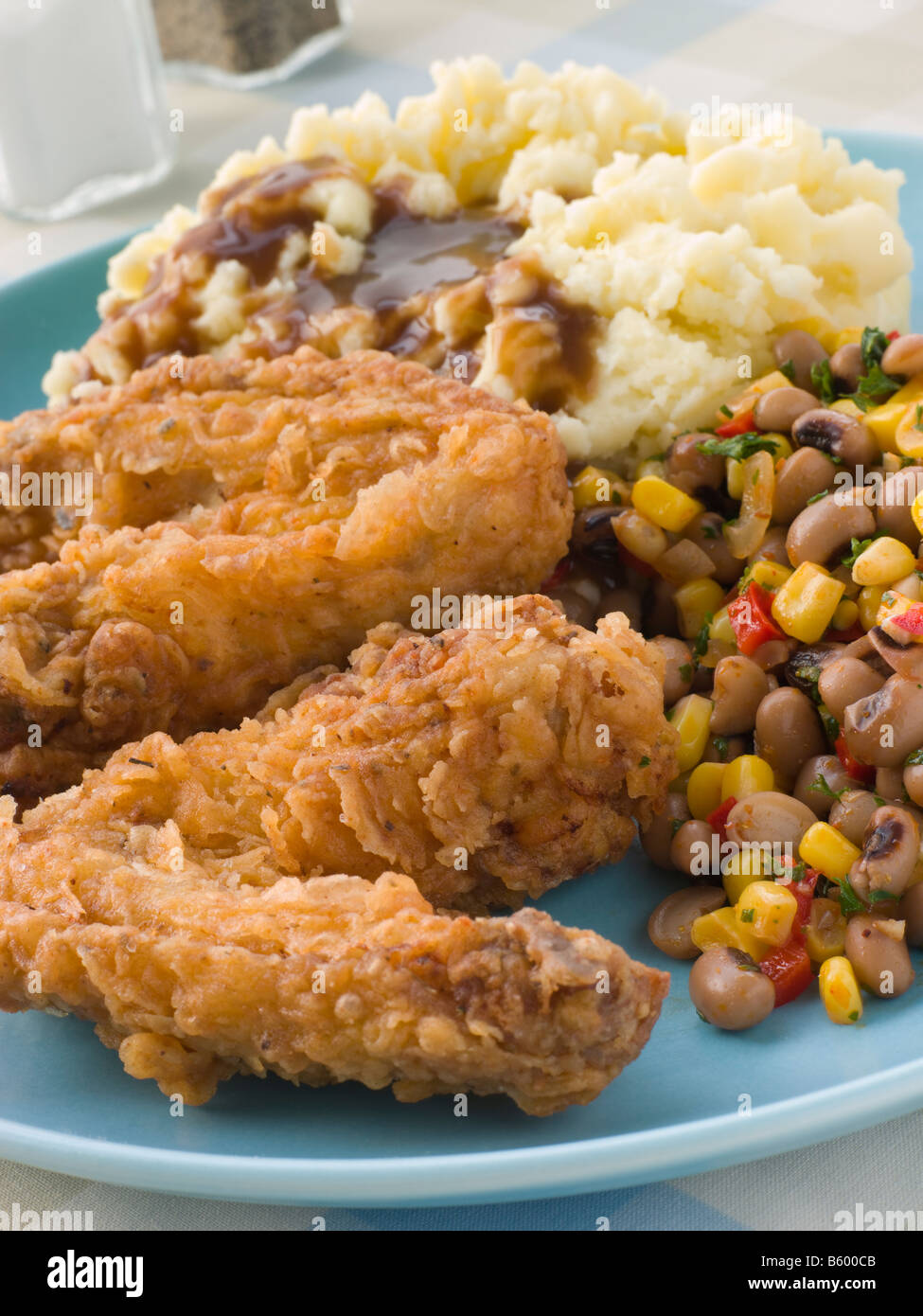 Southern Fried Chicken Wings with Mash Potato Beans and Gravy Stock Photo