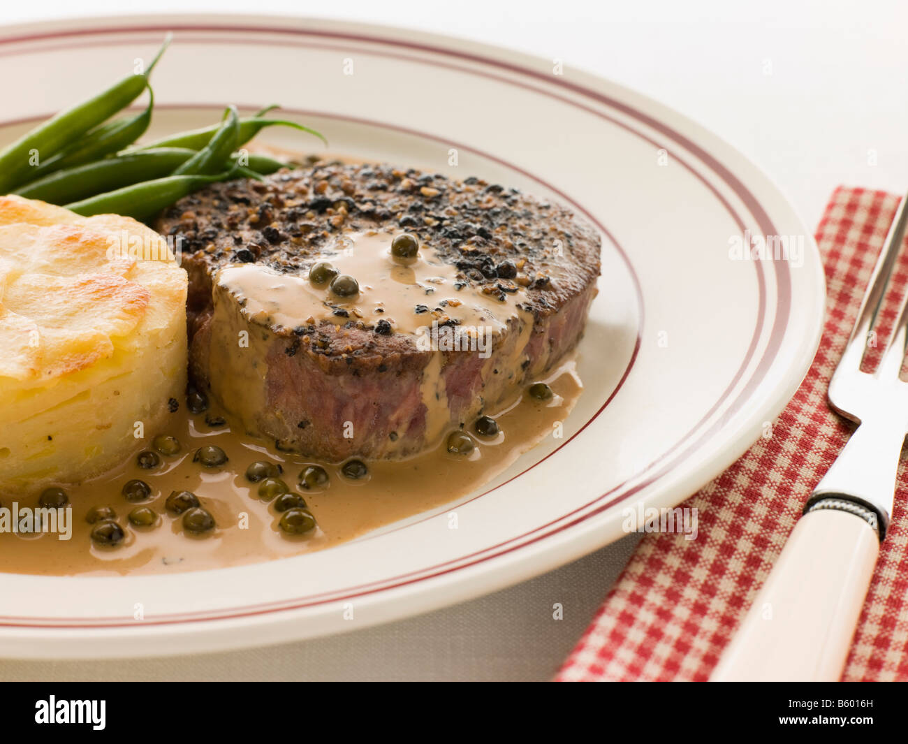 Filet Mignon au Poirve' with French Beans and Pomme Anna Stock Photo