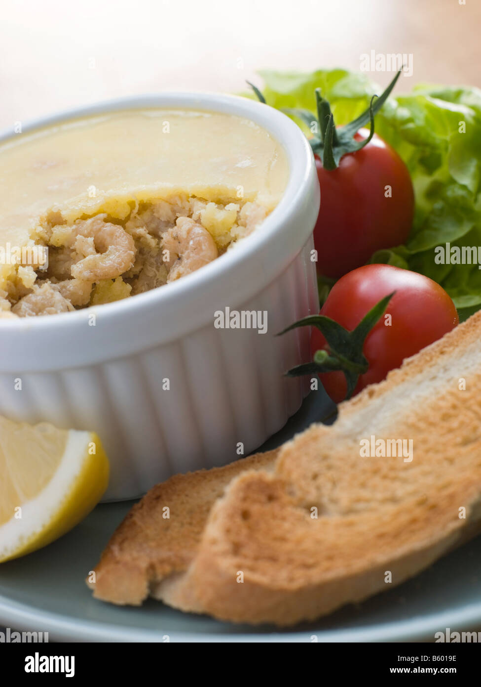 Potted Brown Shrimp with Toast and Salad Stock Photo