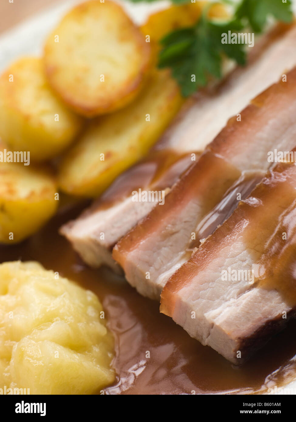 Roasted Belly Pork with Fried Potatoes and Apple Sauce Stock Photo Alamy