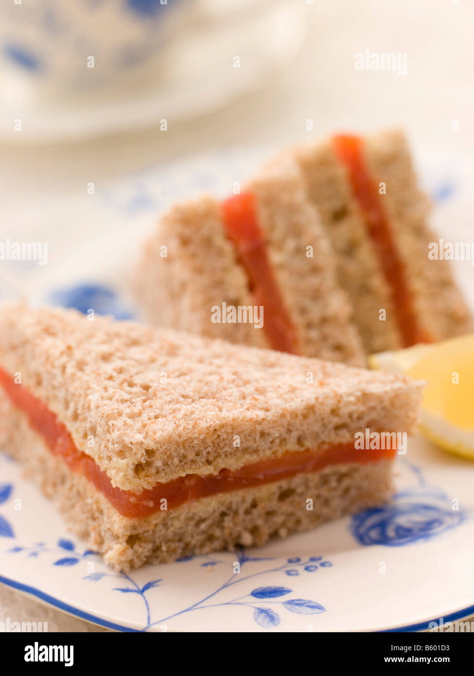Smoked Salmon Sandwich on Brown Bread with Afternoon Tea Stock Photo