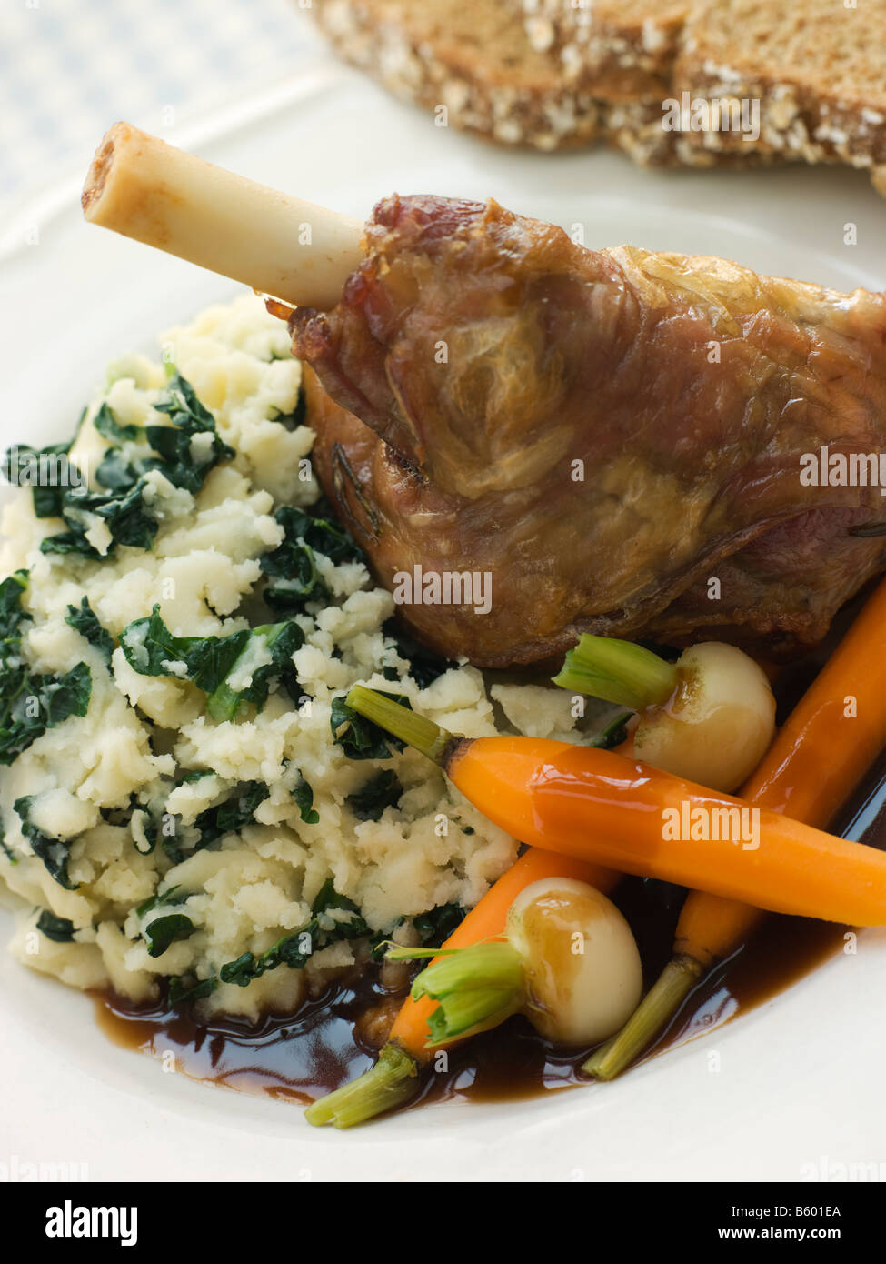 Slow Roasted Spring Lamb Shank with Colcannon and Soda Bread Stock Photo