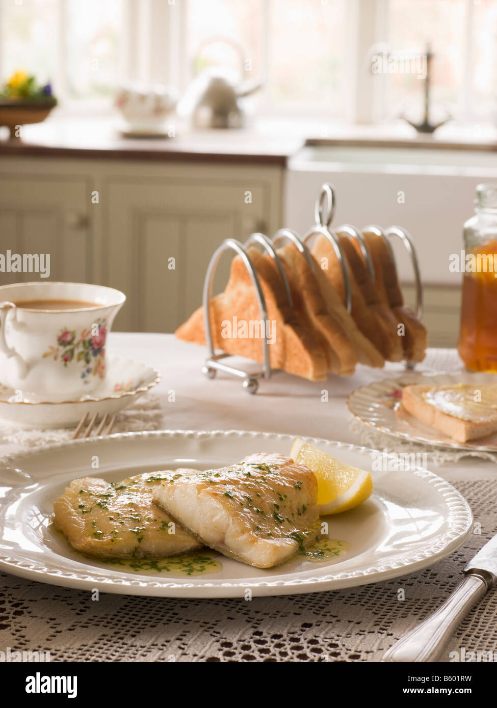 Smoked Haddock with Herb Butter and Toast Stock Photo Alamy