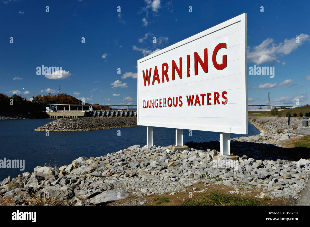Dangerous Waters Warning Sign on Shore at the Tailwaters of the Watts Bar Dam on the Tennessee River Meigs County Tennessee Stock Photo