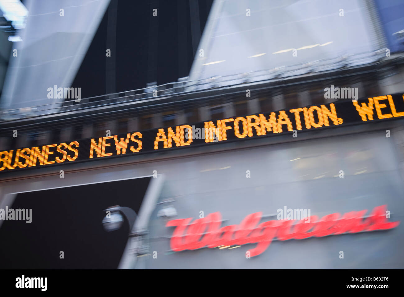 Business news and information appears on the Dow Jones news ticker at 1