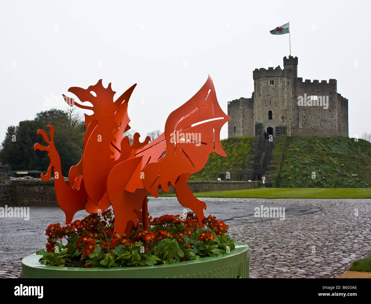 A view of Cardiff Castle with the Welsh Dragon in the foreground Stock Photo