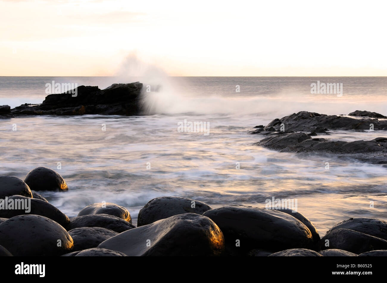 Waves splashing on the rocks on Embleton beach Northumberland UK Stock Photo