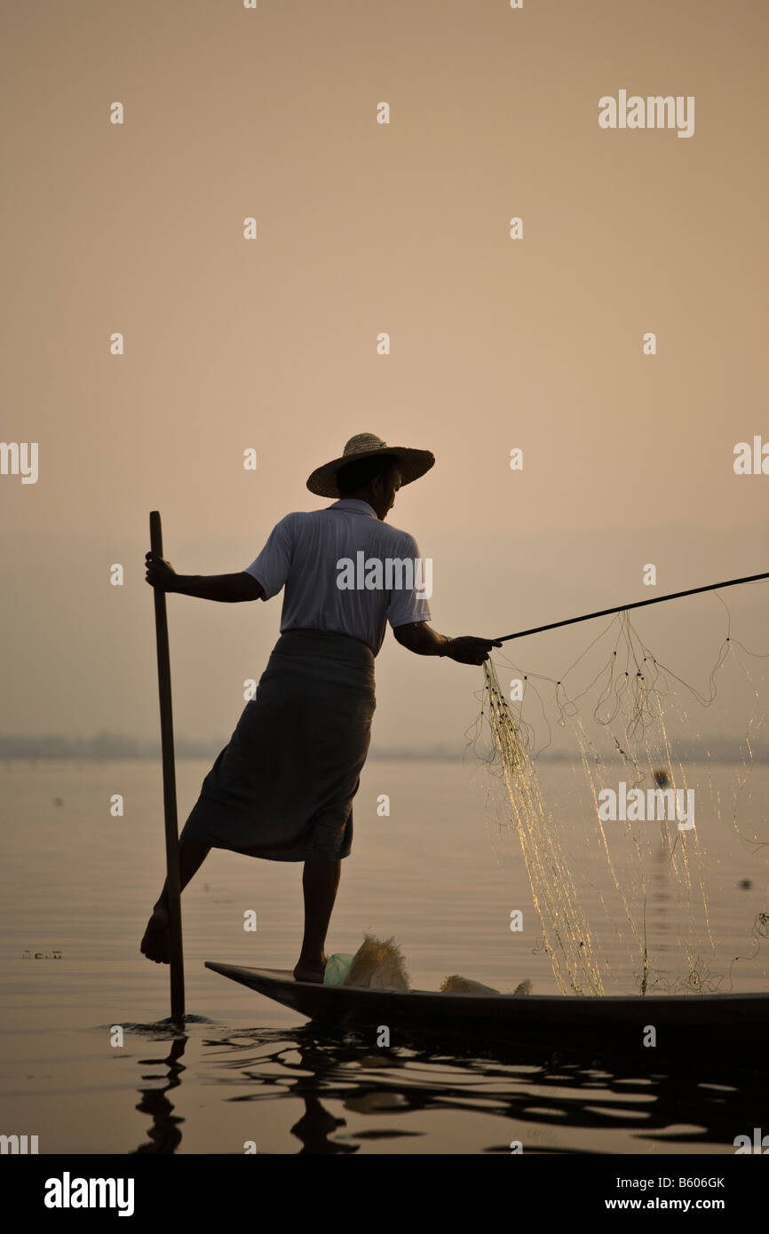 Leg rower traditional fishing at the sunset Inle Lake Myanmar Asia ...