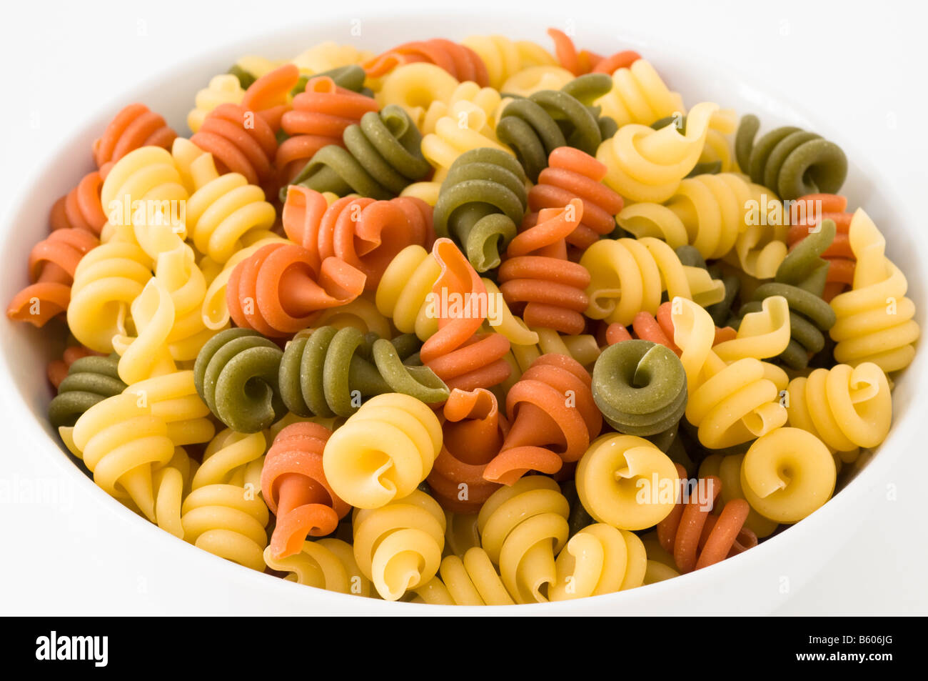 Colourful pasta in white bowl Stock Photo Alamy