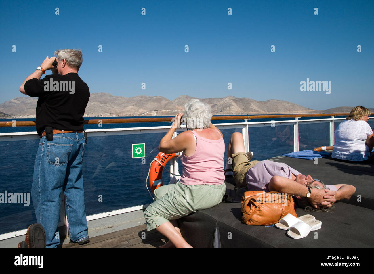 Senior tourists at sea on easyCruise in the Aegean off the coast of Greece Stock Photo