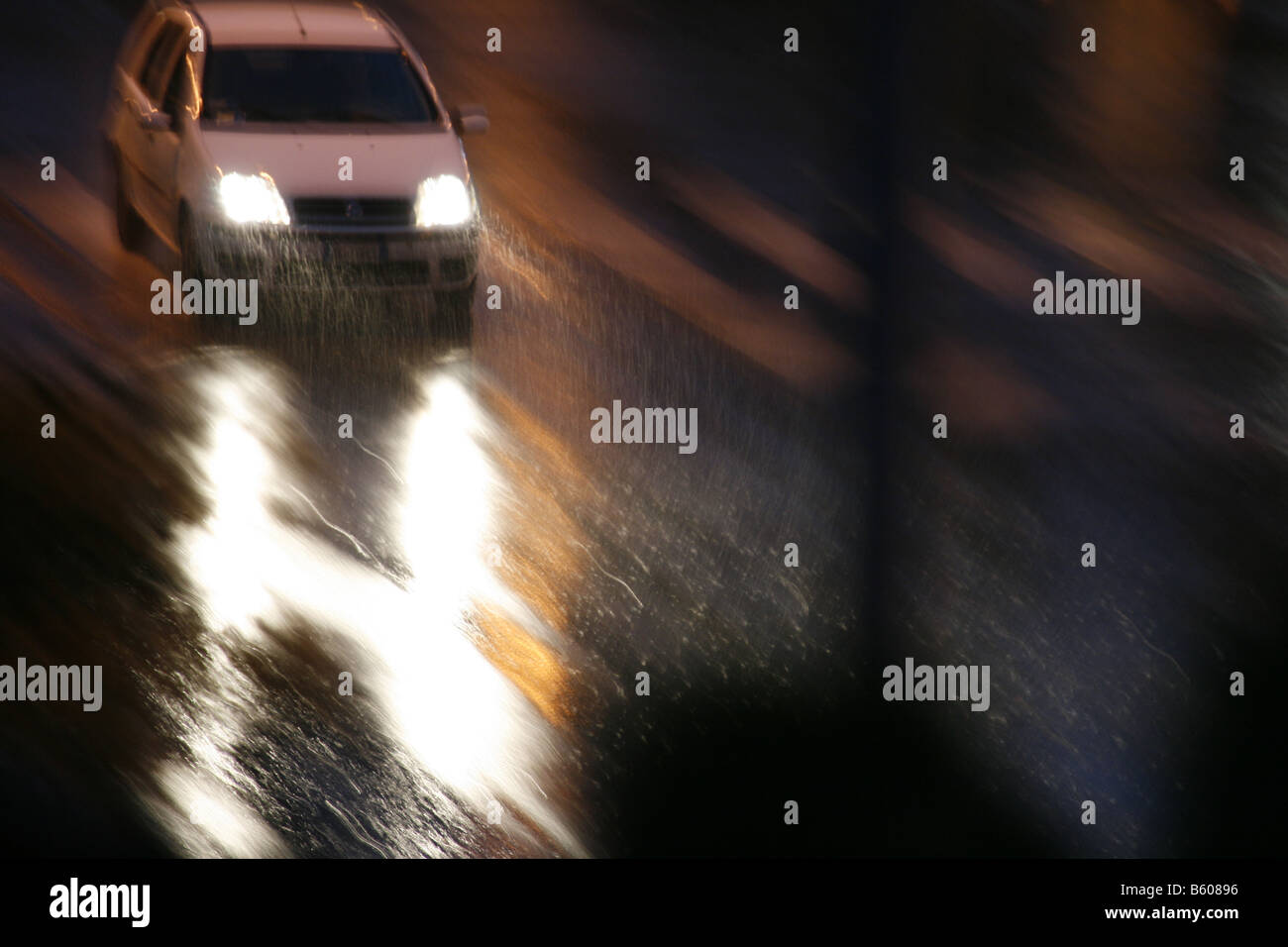 fast car driving in heavy rain at night in town Stock Photo - Alamy