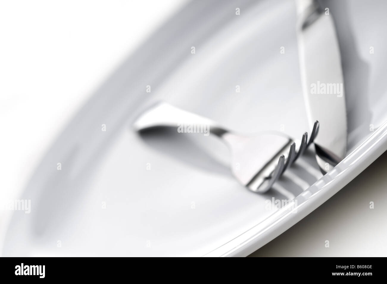 shallow focus silverware on a plate Stock Photo