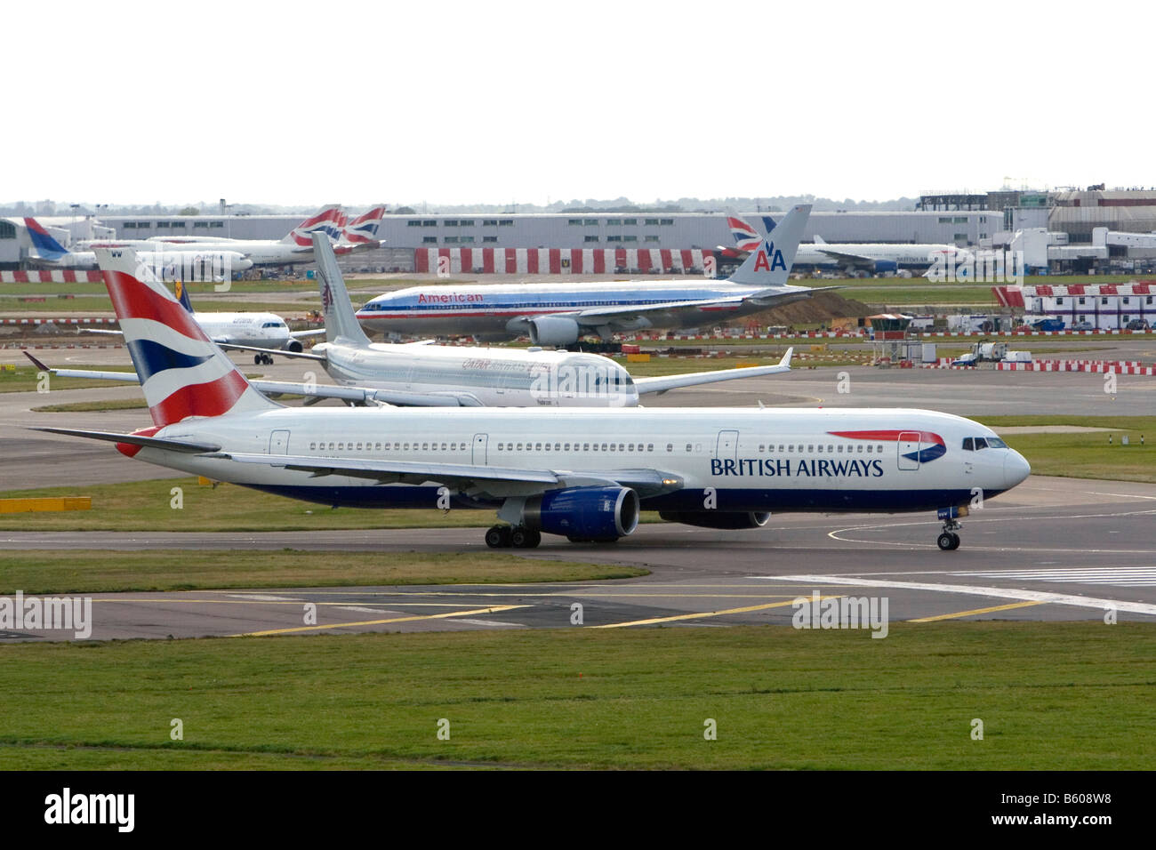 Airliners on the runway at London Heathrow Airport England United Kingdom Stock Photo