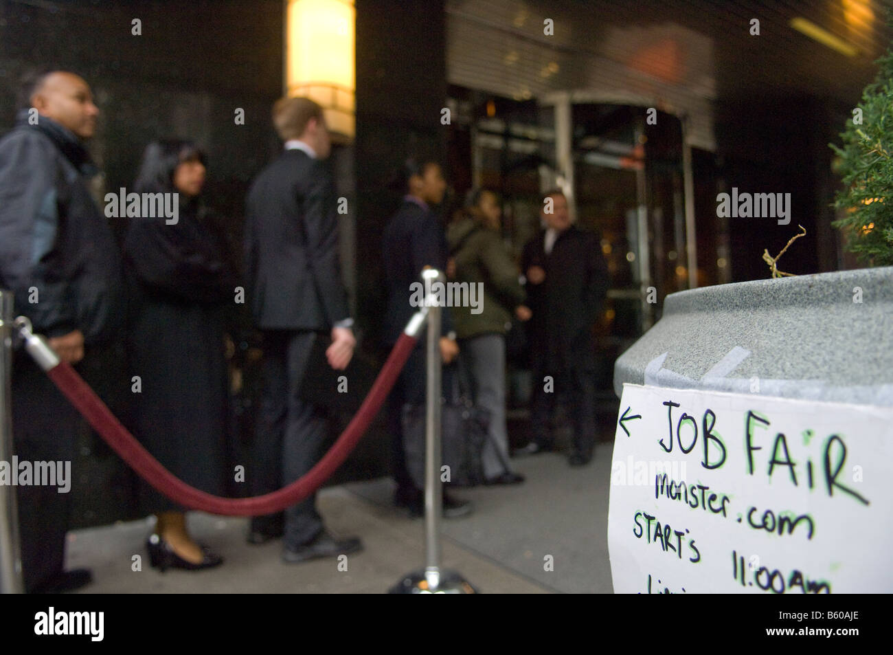 Hundreds of people line up in New York at a job fair sponsored by the website Monster com Stock Photo